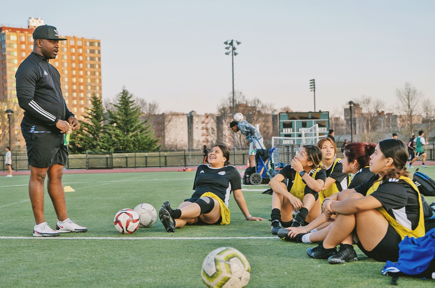 Soccer coach talking to his team